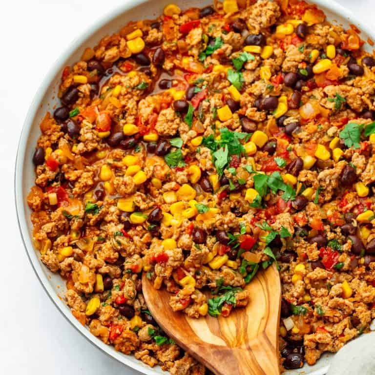 easy ground turkey skillet dinner in bowl with spoon.