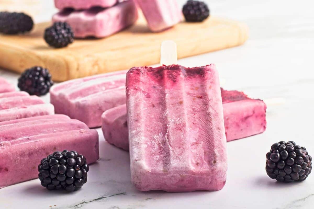 blackberry coconut milk popsicles stacked.