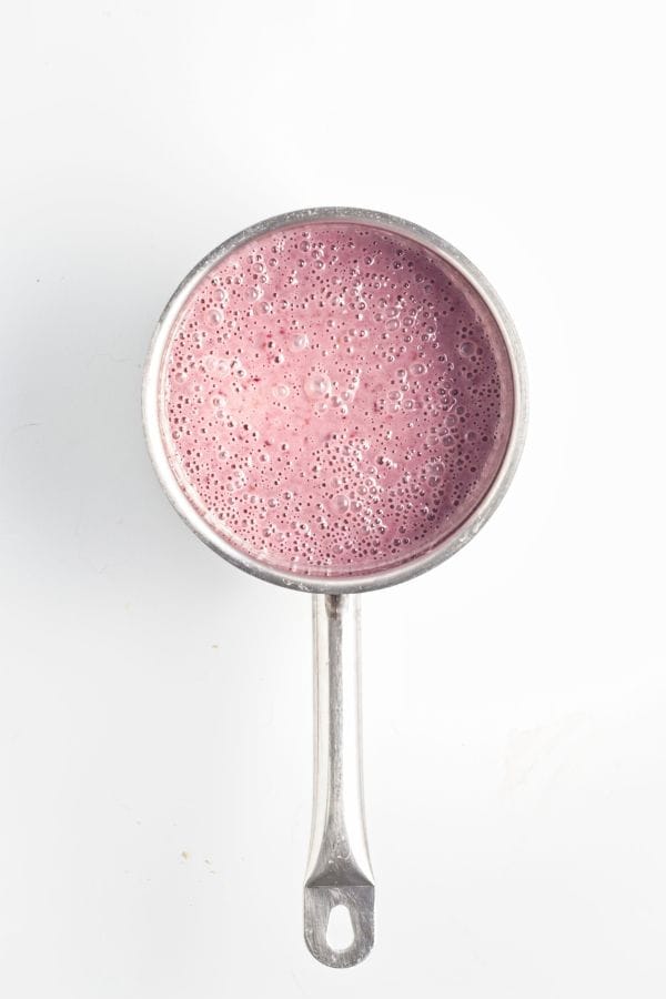 blackberry fruit popsicle mixture in saucepan.